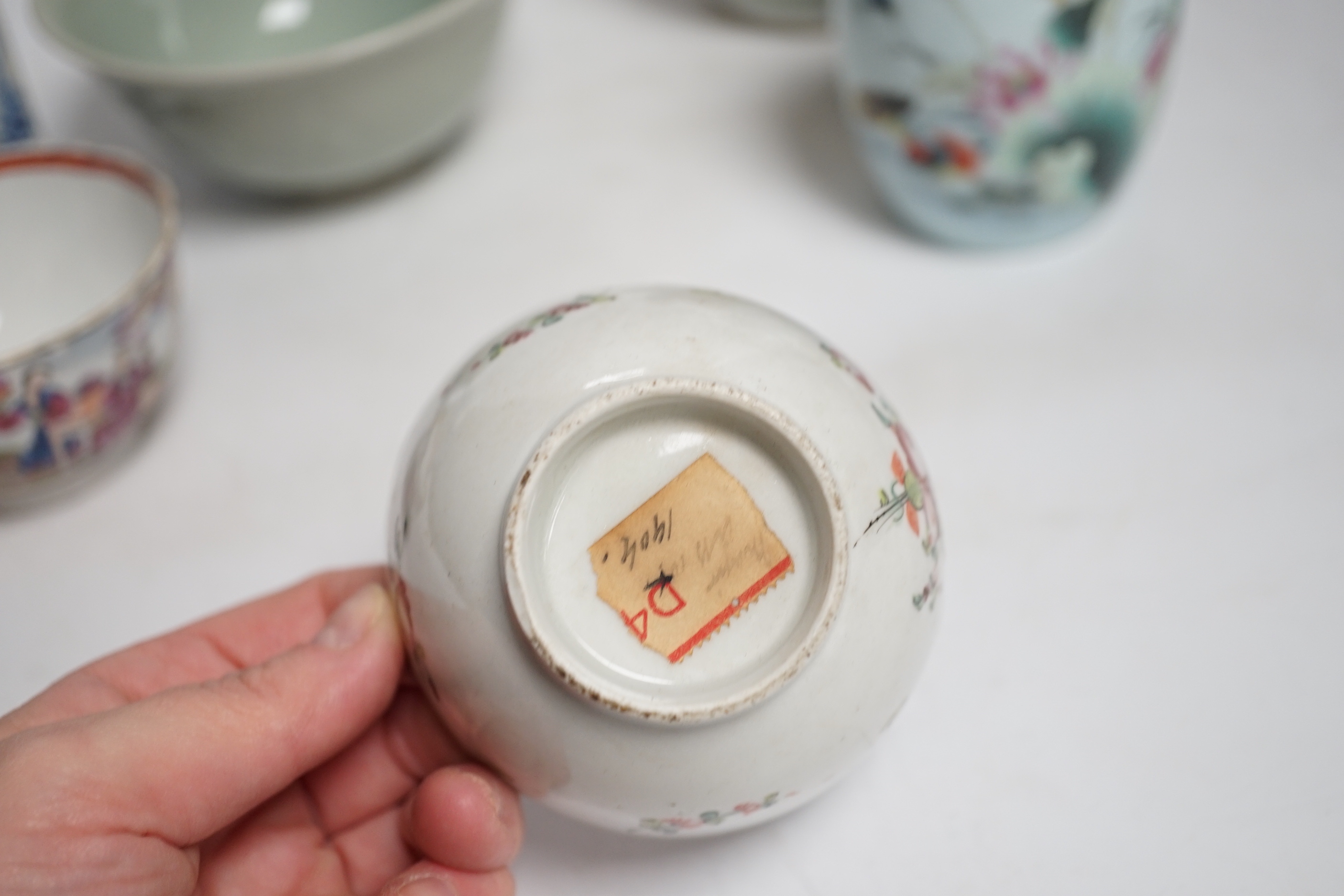 A collection of Chinese ceramics including celadon bowl decorated in low relief with fish, famille rose tea bowls and a jar, largest 12cm high